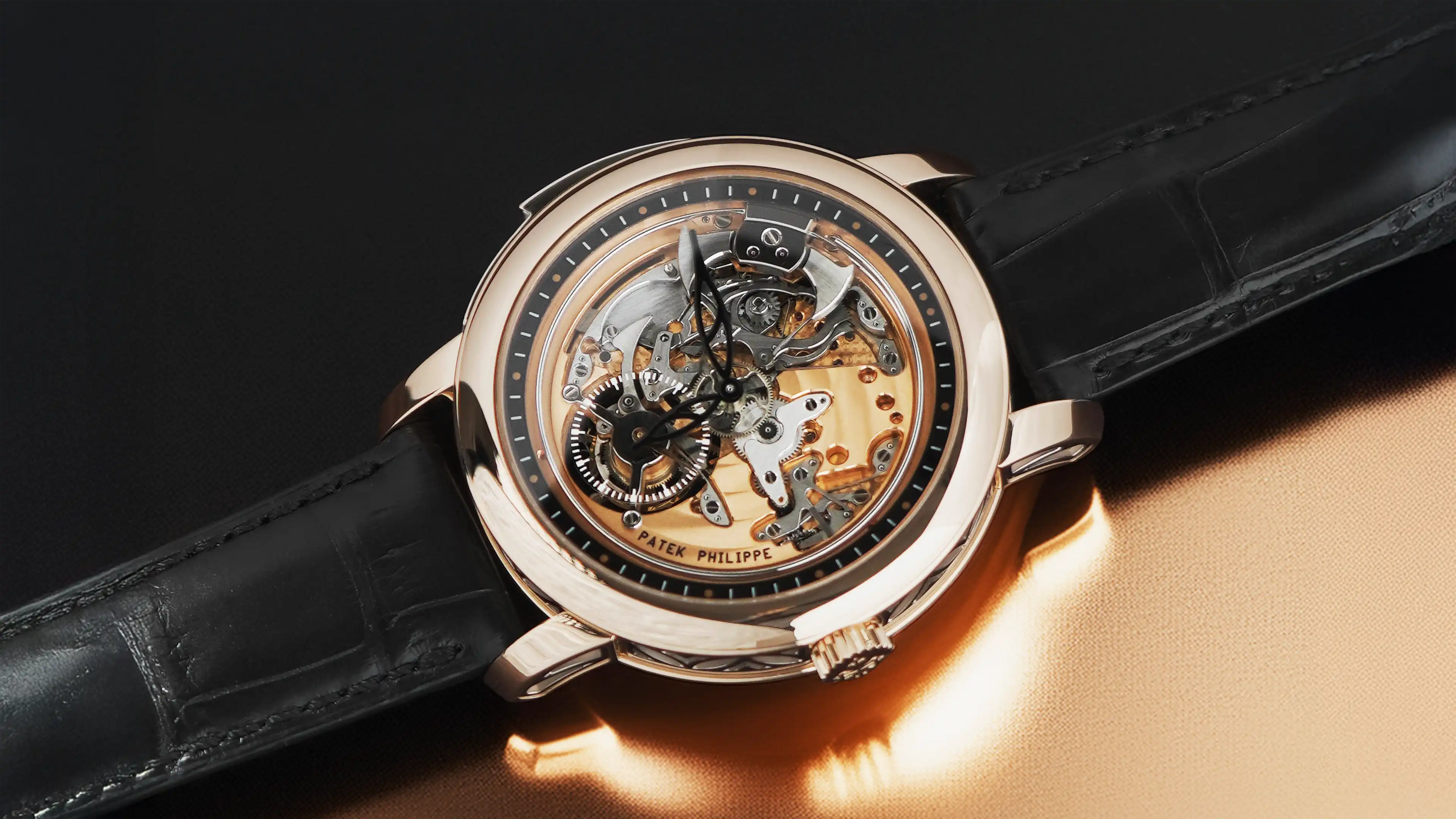 Luxury watch with visible mechanical components on a dark background